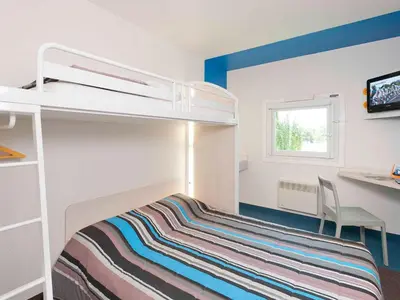 Un ou plusieurs lits dans un hébergement de l'établissement KRYSTAL HOTEL