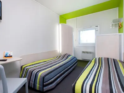Un ou plusieurs lits dans un hébergement de l'établissement KRYSTAL HOTEL
