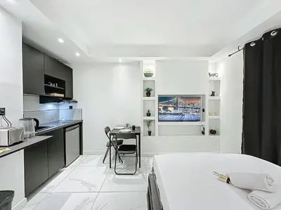 Cuisine ou kitchenette dans l'établissement Cosy Appartement, Part Dieu André Philipe