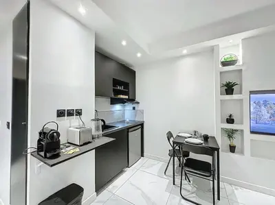 Cuisine ou kitchenette dans l'établissement Cosy Appartement, Part Dieu André Philipe