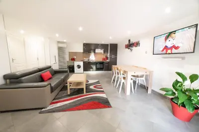 Coin salon dans l'établissement Appartement Gardhenn Stadium LCLD Arena Groupama Lyon