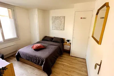 Un ou plusieurs lits dans un hébergement de l'établissement Appartement 3 chambres + parking à Lyon 7