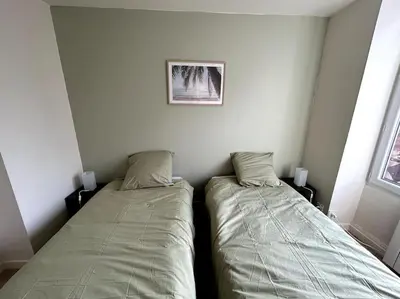 Un ou plusieurs lits dans un hébergement de l'établissement Appartement lumineux en centre-ville / Proche Gare