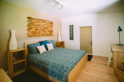 Un ou plusieurs lits dans un hébergement de l'établissement Le clos du chêne - Chambres dans maison Bressane à Saint Trivier sur Moignans