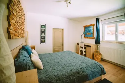 Un ou plusieurs lits dans un hébergement de l'établissement Le clos du chêne - Chambres dans maison Bressane à Saint Trivier sur Moignans