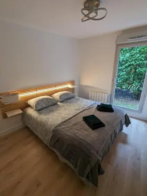 Un ou plusieurs lits dans un hébergement de l'établissement Comfort and tranquility near Lyon and Groupama Stadium, 4 personnes