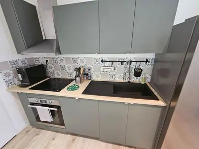 Cuisine ou kitchenette dans l'établissement Le 14B