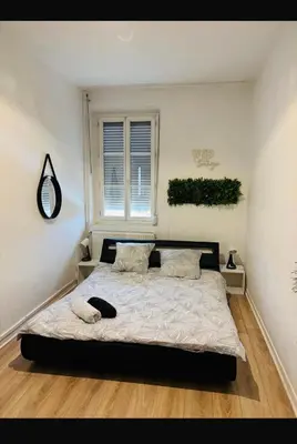 Un ou plusieurs lits dans un hébergement de l'établissement Appartement cosy LYON