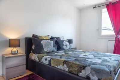Un ou plusieurs lits dans un hébergement de l'établissement Appartement Fuychaa Proche de Lyon , Eurexpo , stadium , Aréna