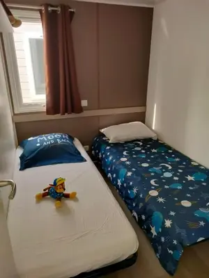 Un ou plusieurs lits dans un hébergement de l'établissement Mobil-home Siblu Les Rives de Condrieu