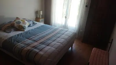 Un ou plusieurs lits dans un hébergement de l'établissement Chambre dans un écrin de verdure