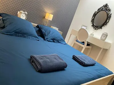 Un ou plusieurs lits dans un hébergement de l'établissement La Bonneterie Appartement de charme avec terrasse