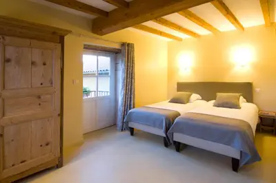 Un ou plusieurs lits dans un hébergement de l'établissement B&B La Cerisaie