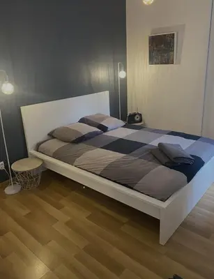 Un ou plusieurs lits dans un hébergement de l'établissement Chambre confort centre ville chez l'habitant