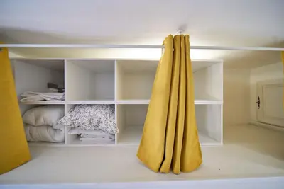 Un ou plusieurs lits dans un hébergement de l'établissement Duguesclin Baroque / appartement de charme