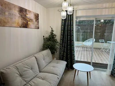 Coin salon dans l'établissement L'Écrin de Marie-Lou Studio Cosy