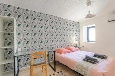Un ou plusieurs lits dans un hébergement de l'établissement Gîte La Terrasse, 4 chambres, 10 pers, Centre Ville