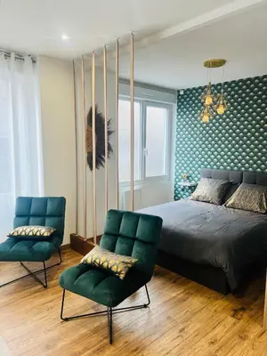 Coin salon dans l'établissement Détente, Spa et Parking privé