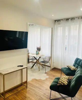 Télévision ou salle de divertissement dans l'établissement Détente, Spa et Parking privé