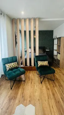 Coin salon dans l'établissement Détente, Spa et Parking privé
