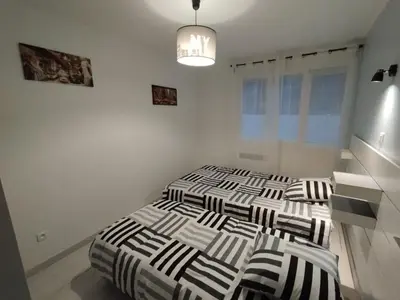 Un ou plusieurs lits dans un hébergement de l'établissement Maison dans quartier résidentiel