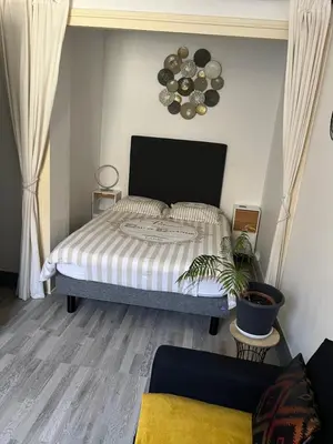 Un ou plusieurs lits dans un hébergement de l'établissement Chic & Elégance Lyon Centre