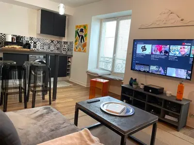 Télévision ou salle de divertissement dans l'établissement 22 COEUR DE VIENNE