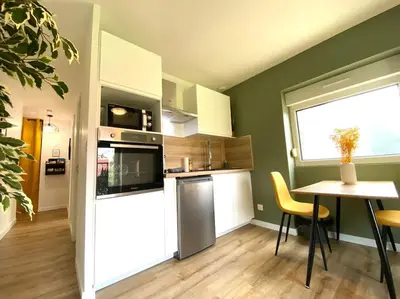 Cuisine ou kitchenette dans l'établissement Appartements avenue général Leclerc