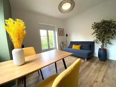 Coin salon dans l'établissement Appartements avenue général Leclerc