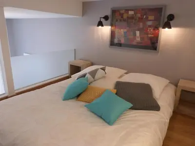 Un ou plusieurs lits dans un hébergement de l'établissement Appart Touriste