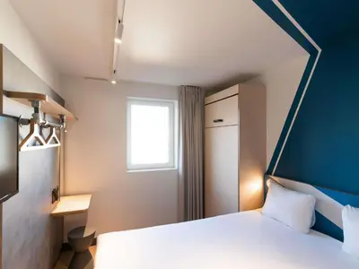 Un ou plusieurs lits dans un hébergement de l'établissement ibis budget Lyon Centre Confluence