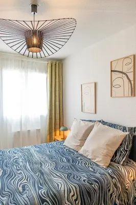 Un ou plusieurs lits dans un hébergement de l'établissement Villeurbanne Centre Appartement Meublé