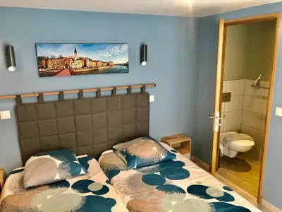 Un ou plusieurs lits dans un hébergement de l'établissement Maison d'hôtes Côté Saône