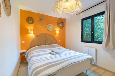 Un ou plusieurs lits dans un hébergement de l'établissement La Cabane Ô Rêves