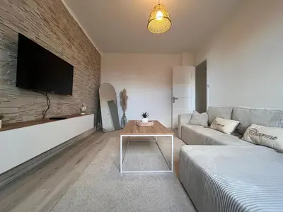 Télévision ou salle de divertissement dans l'établissement Logement chaleureux et lumineux