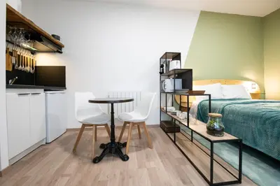 Un ou plusieurs lits dans un hébergement de l'établissement Suite Kella Tassin - Beau studio rénové