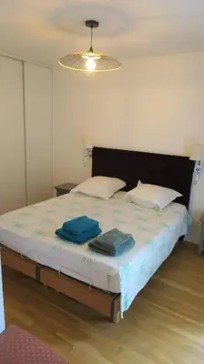 Un ou plusieurs lits dans un hébergement de l'établissement Appartement confortable calme avec terrasse proche métro - accueil personnel