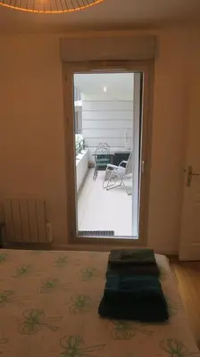 Un ou plusieurs lits dans un hébergement de l'établissement Appartement confortable calme avec terrasse proche métro - accueil personnel
