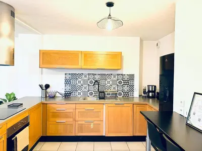 Cuisine ou kitchenette dans l'établissement *Le Golden Tropic* Magnifique T4 Terrasse+Parking