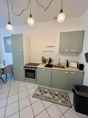 Cuisine ou kitchenette dans l'établissement Le Cocon des épices
