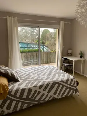 Un ou plusieurs lits dans un hébergement de l'établissement Chambre Serenity