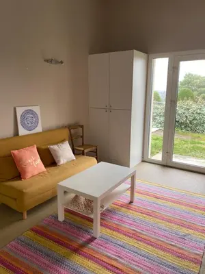 Coin salon dans l'établissement Chambre Serenity