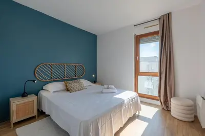 Un ou plusieurs lits dans un hébergement de l'établissement Appartement des Tourelles - Welkeys