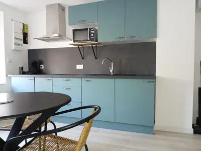 Cuisine ou kitchenette dans l'établissement L exotique