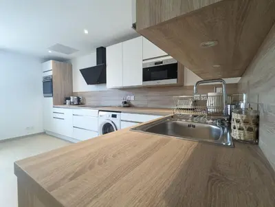 Cuisine ou kitchenette dans l'établissement L'élégant 152 proche aéroport lyon