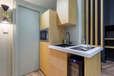 Cuisine ou kitchenette dans l'établissement Suite Romantique Balnéo Centre Lyon