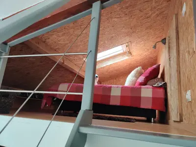 Un ou plusieurs lits dans un hébergement de l'établissement Studio Belle Vue