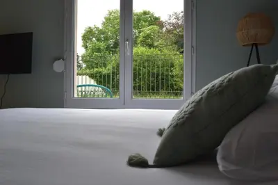 Un ou plusieurs lits dans un hébergement de l'établissement L'Aquarelle - Appartement cosy, GroupamaStadium LDLC Arena