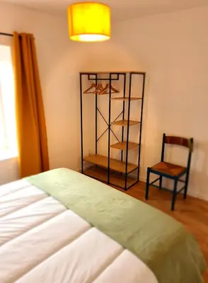 Un ou plusieurs lits dans un hébergement de l'établissement Gîte Le Petit Velours