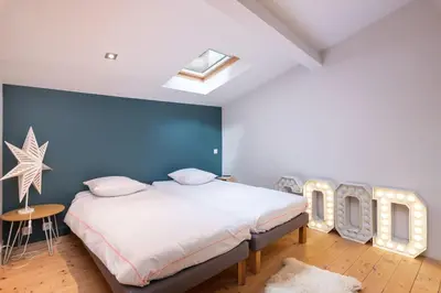 Un ou plusieurs lits dans un hébergement de l'établissement Le Pressoir - Newly refurbished house with contemporary decoration